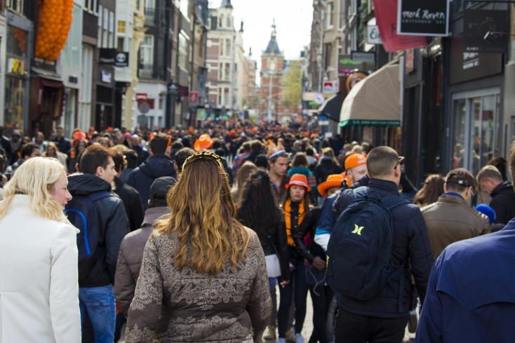 People walking through busy street