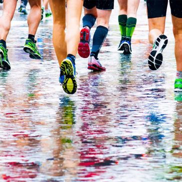 People running in the rain