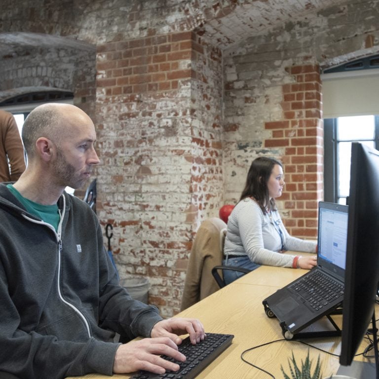 SEO team at their laptops