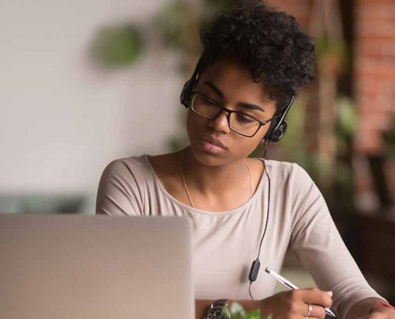 Girl studying on her laptop