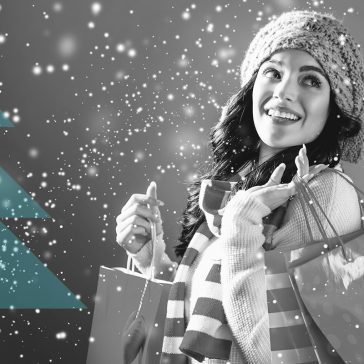 Woman smiling shopping in the snow