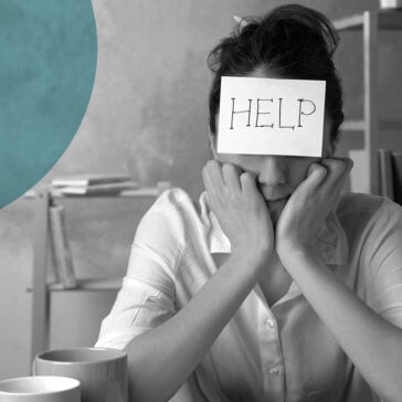 Woman stressed with help sticker on her head