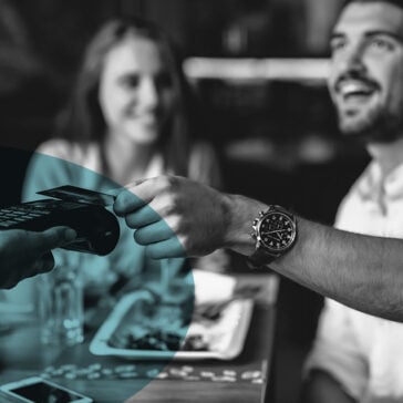 man paying bill in restaurant