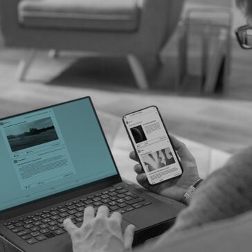 Man surfing the net on his laptop and phone